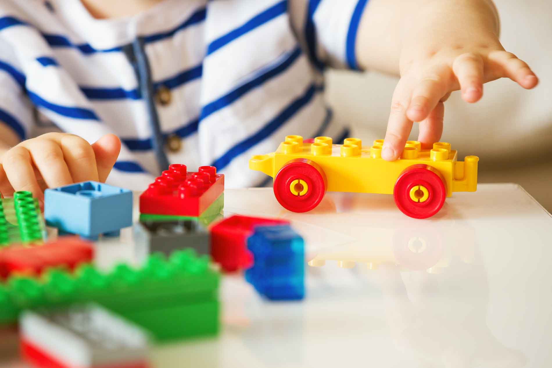 Child building with LEGO blocks at daycare in Deer Park, TX